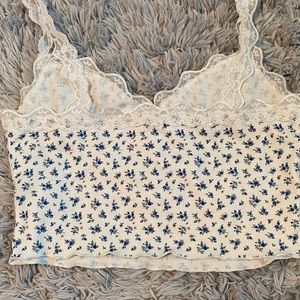 Super cute top with flower print and lace straps.